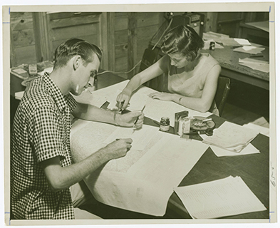 Geography students drawing maps during a class